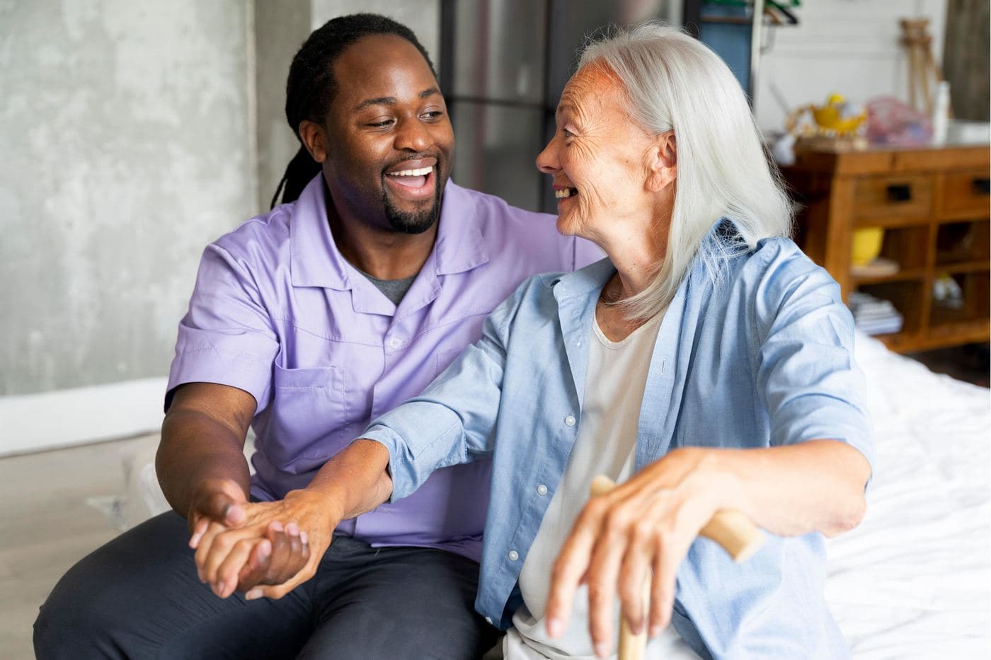 A caregiver sharing a warm moment with a senior client